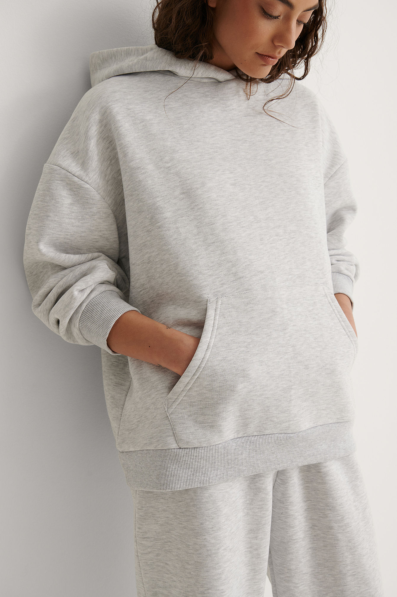 Grey Melange Sweatshirt à capuche à poche oversize biologique