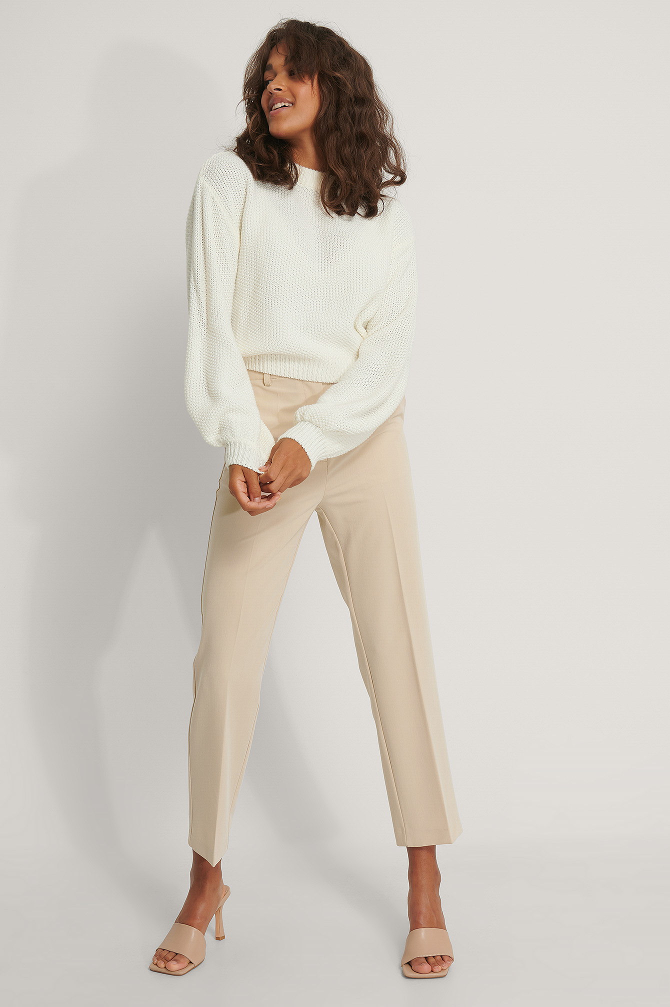Balloon Sleeve Knitted Cropped Sweater with Beige Suit Pants.