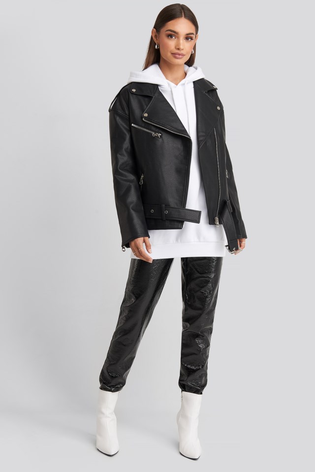 Style this jacket with an oversized hoodie, patent pants, boots, and silver accessories.