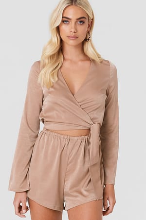 Beige Andrea Hedenstedt x NA-KD Wrapped Trumpet Sleeve Playsuit