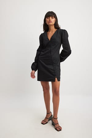 Black Robe courte asymétrique boutonnée à manches longues