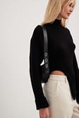 Black Pull en maille côtelée asymétrique