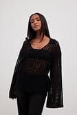 Black Pull en maille crochetée à col en V