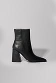 Black Bottes en cuir à talon carré biseauté