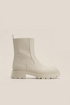 Cream Bottines à bout ornementé