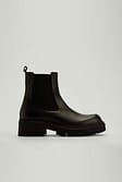 Black Bottes épaisses en cuir à tige profilée