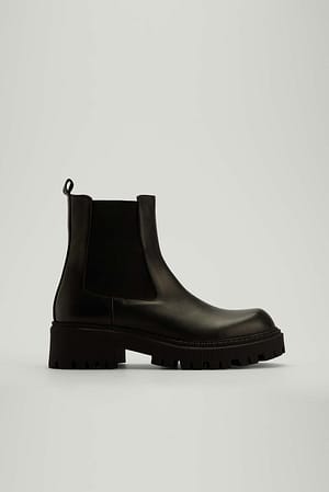 Black Bottes épaisses en cuir à tige profilée