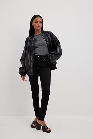 Black Jean slim taille haute à ourlet ouvert