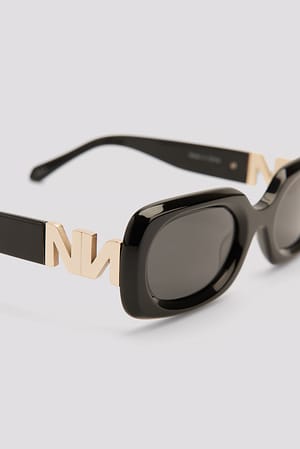 Black Lunettes de soleil en acétate à monture fine ronde