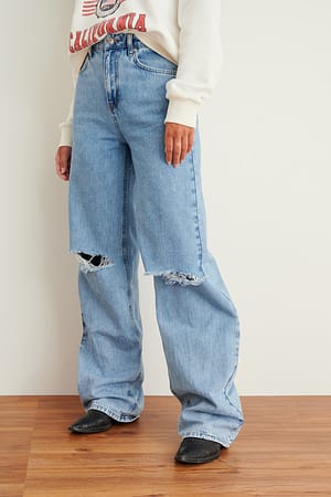 Light Blue Jeans large rigide doux déchiré
