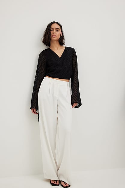 Black Blouse cache-cœur structurée à manches trompette