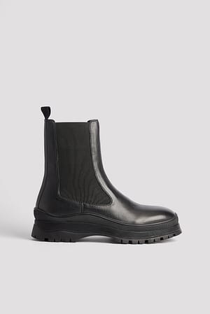 Black Bottes en cuir à semelle ondulée