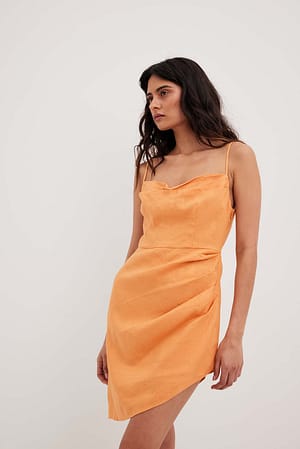 Orange Robe portefeuille en lin à décolleté en cascade