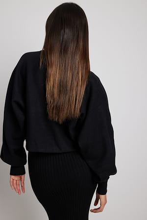 Black Pull court en tricot à col rond