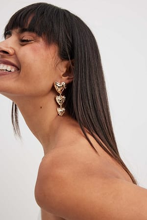 Gold Boucles d'oreilles avec trois cœurs